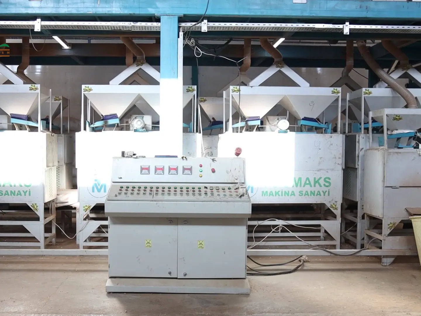 A row of laser sorting machines with their control panel